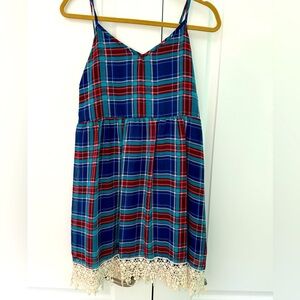 Size large, spaghetti strap to the knee plaid summer/fall dress. Lined, pleated